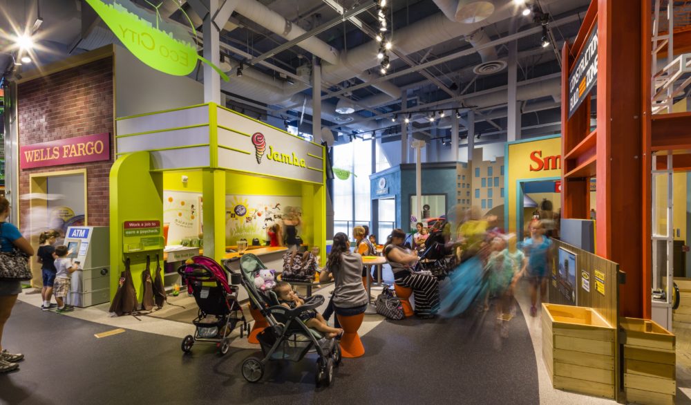 Children and adults enjoying the exhibits at the Discovery Children's Museum, designed by LGA Architecture.