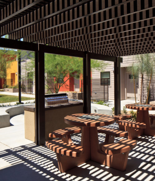 The rear backyard and barbeque area of the St Jude's Ranch Crossings affordable housing project, designed by LGA Architecture.